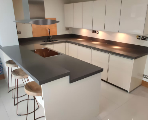 Gloss Cream Kitchen with Grey Solid Surface Worktops