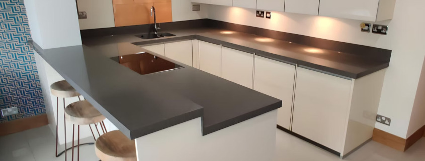 Gloss Cream Kitchen with Grey Solid Surface Worktops